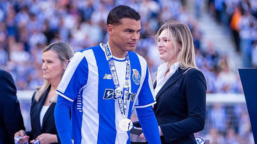 Thiago Silva receives his medal having won the Portuguese league