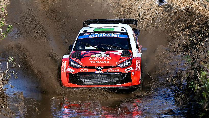 Elfyn Evans' Toyota descends into muddy water at Rally Kenya