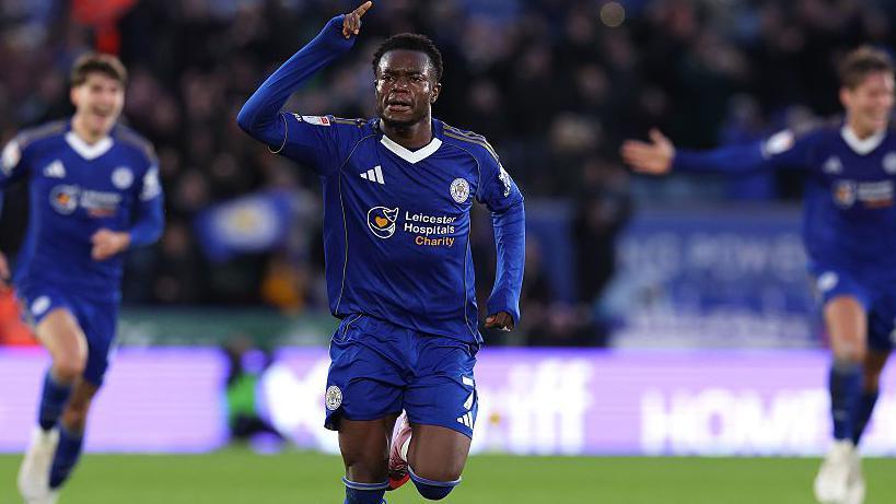 Abdul Fatawu raises his right hand in celebration of his sensational goal for Leicester against Ipswich