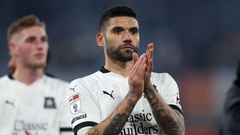 Victor Palsson claps the fans