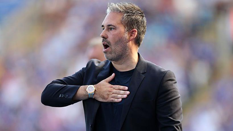 Leicester City manager Marti Cifuentes taps his chest