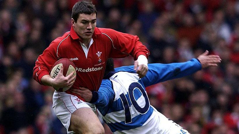 Iestyn Harris avoids a tackle on his Wales debut against Argentina