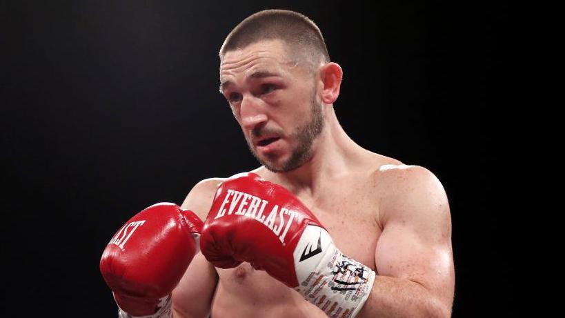 James Dickens in boxing gloves