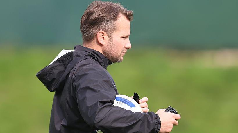 Tom Cleverley taking a training session at Plymouth