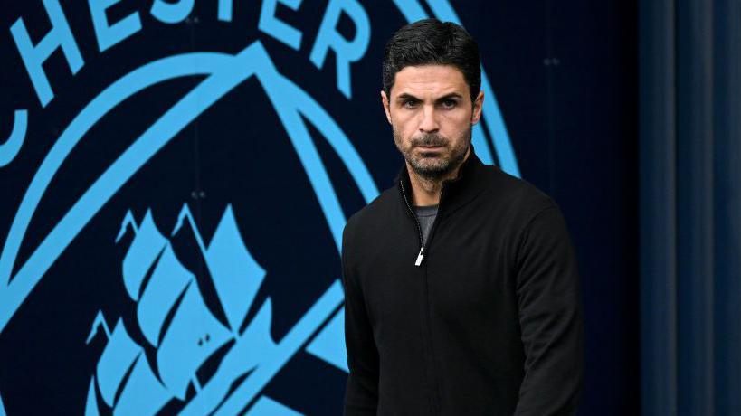 Mikel Arteta looks on at the Etihad 