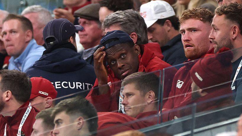 Maro Itoje in the stands with his Lions team-mates