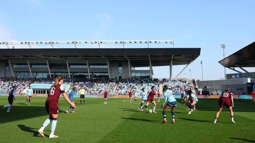 Manchester City playing at Joie Stadium on Etihad Campus