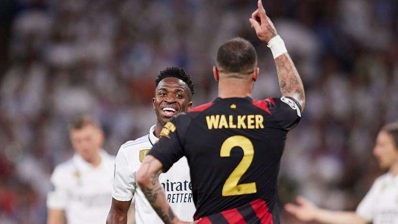 Manchester City's Kyle Walker and Real Madrid's Vinicius Jr share a smile after an epic Champions League battle in the 2023 semi-final first leg