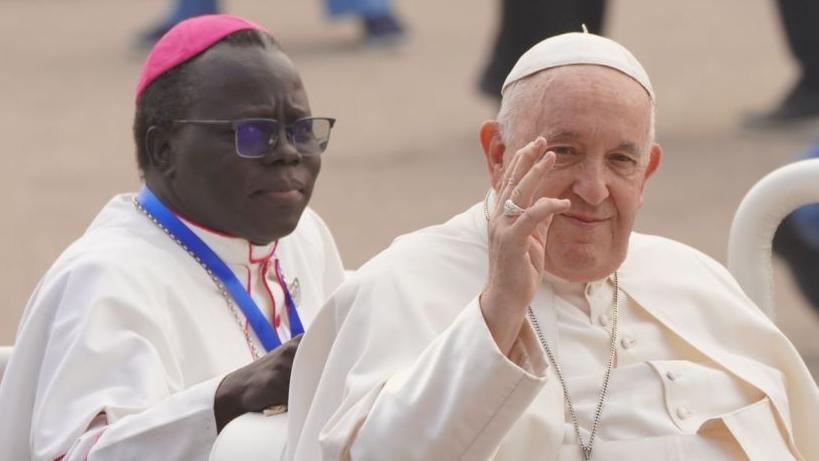 Pope Francis waving and smiling