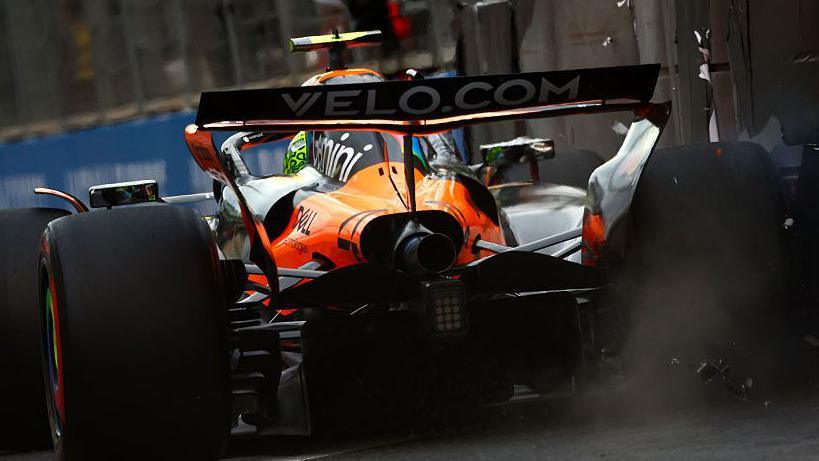 Lando Norris touching the wall in qualifying.