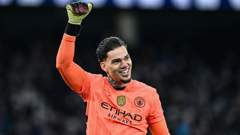 Manchester City Goalkeeper Ederson smiles after Manchester score their fourth goal during the Premier League match between Manchester City FC and Newcastle United FC at Etihad Stadium on February 15, 2025