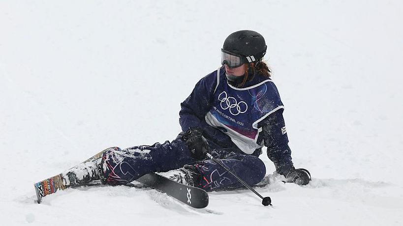 Kirsty Muir sits on the snow