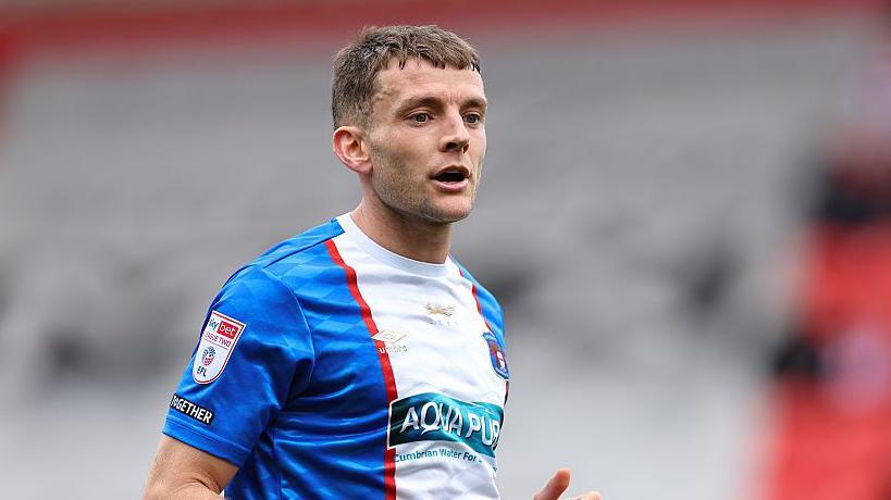 Sam Lavelle on the pitch during a game for Carlisle