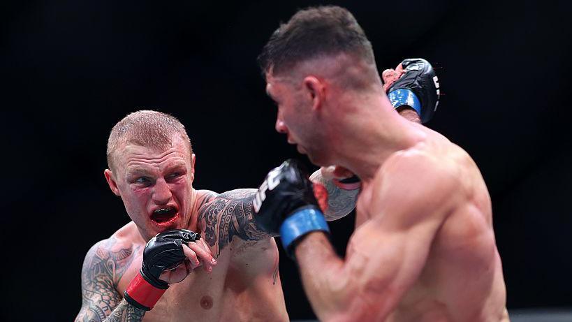 Mason Jones punches Axel Sola