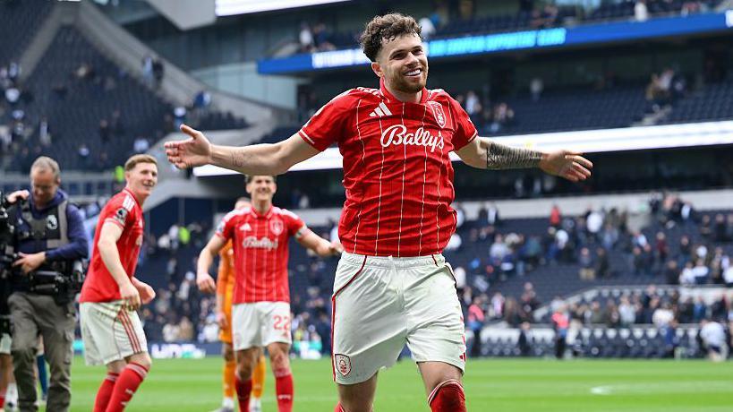 Neco Williams celebrates after scoring at Tottenham Hotspur Stadium