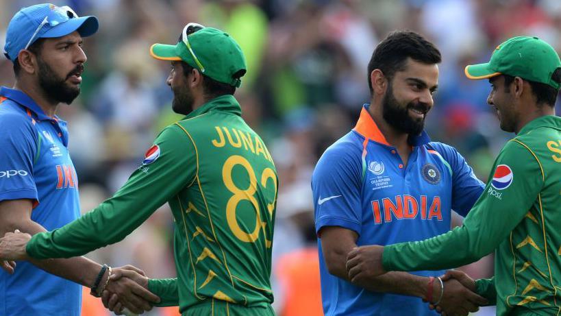 Pakistan and India players, including Virat Kohli, shake hands