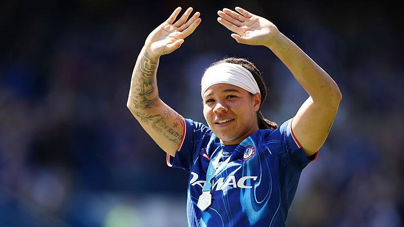 Mia Fishel waving to Chelsea fans