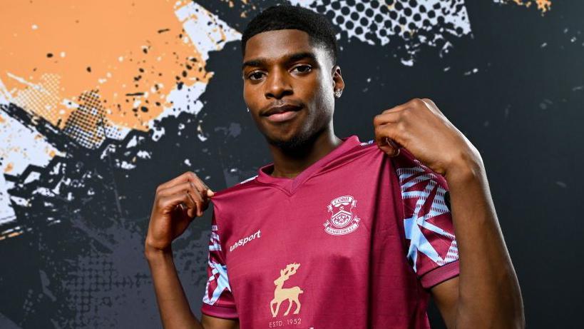 David Eguaibor posing in his Cobh Ramblers shirt in 2024