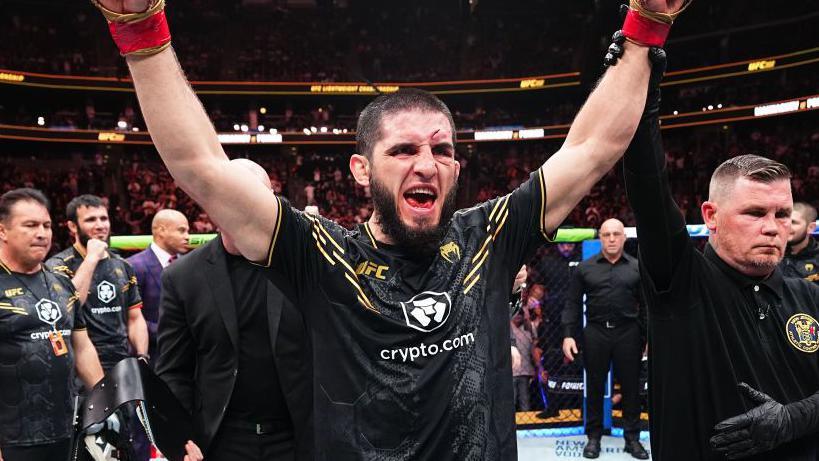 Islam Makhachev celebrates beating Dustin Poirier at UFC 302