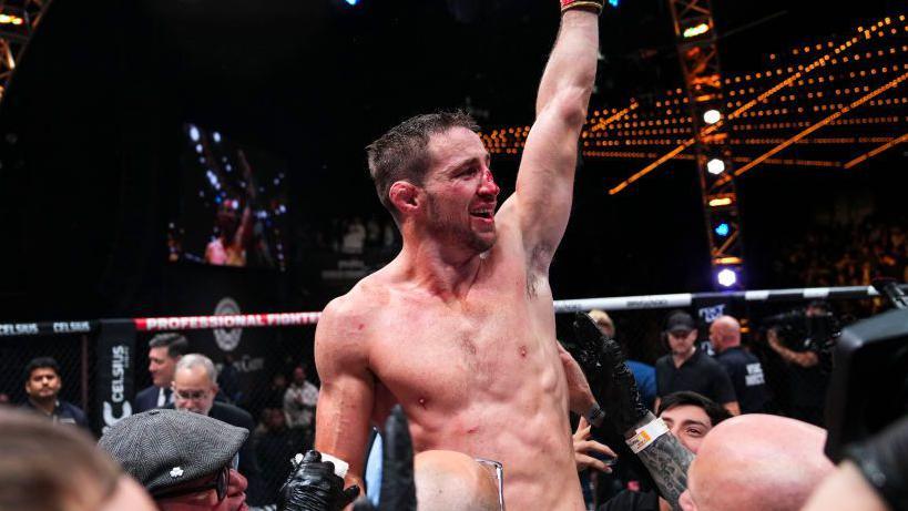 Brendan Loughnane celebrates after winning the PFL featherweight title in 2022