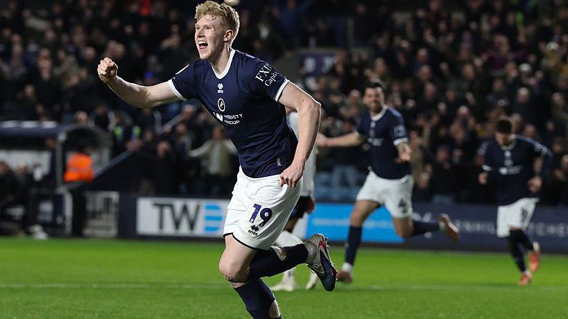 Josh Coburn clenches his right first in celebration at giving Millwall the lead against Derby.