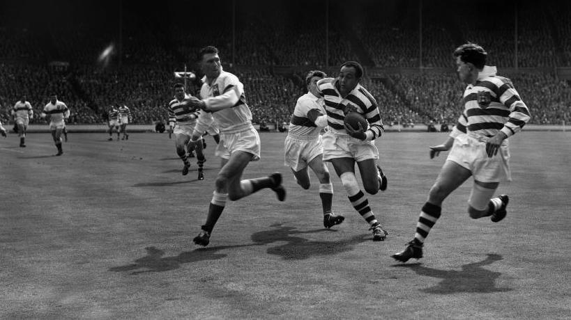 Billy Boston playing rugby in the 1950s.