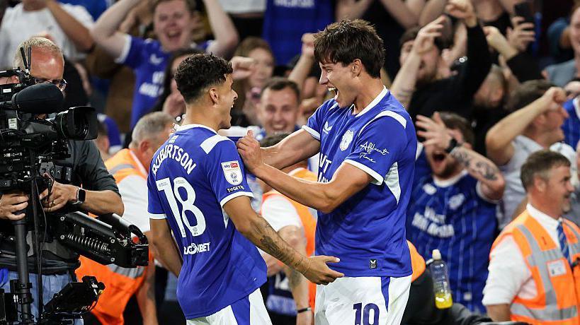 Rubin Colwill celebrates with Alex Robertson 