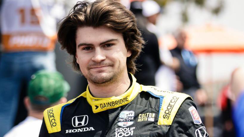 Colton Herta in IndyCar driver outfit