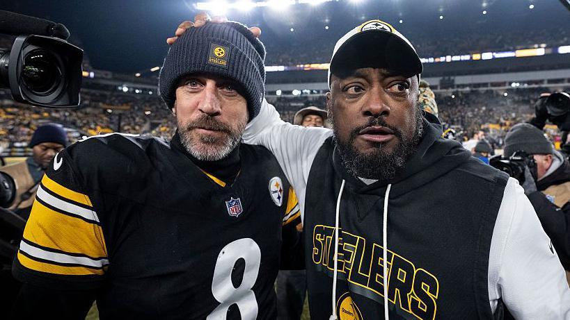 Pittsburgh Steelers quarterback Aaron Rodgers (left) and coach Mike Tomlin (right)