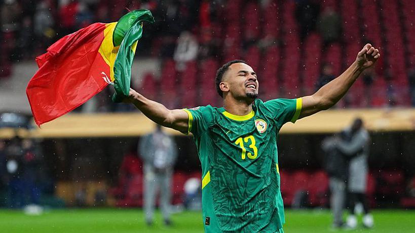 Iliman Ndiaye of Senegal celebrates