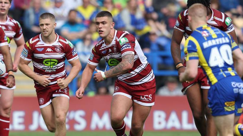 Brad O'Neill (centre) was part of the Wigan Warriors side that won the Challenge Cup final against Warrington Wolves in June