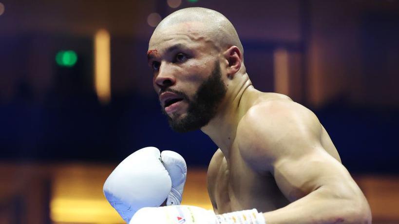 Chris Eubank Jr has a cut above his eyebrow in the ring during a fight