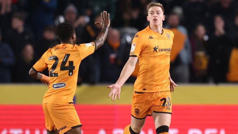 Liam Delap celebrates scoring for Hull City