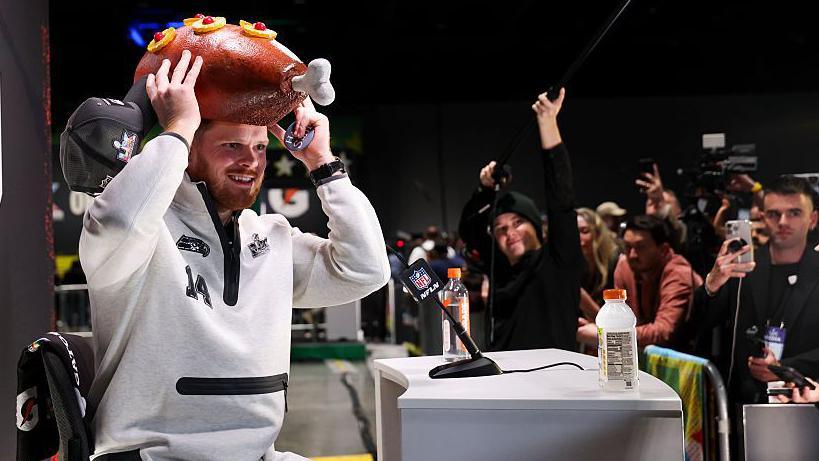 Sam Darnold wearing a turkey hat at Super Bowl Opening Night in 2026