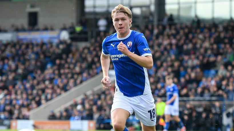 James Berry running on the pitch during a match