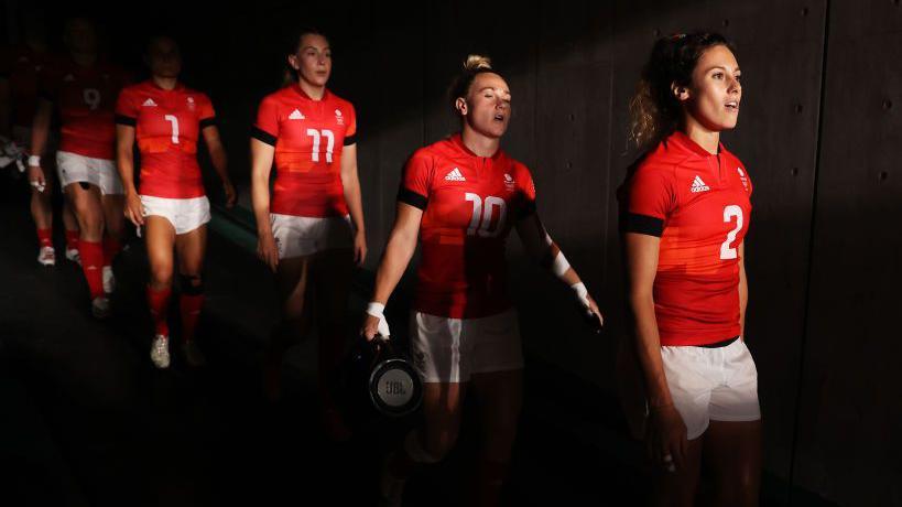 Abbie Brown leads out a GB team including Meg Jones and Holly Aitchison at the Tokyo Olympics in 2021
