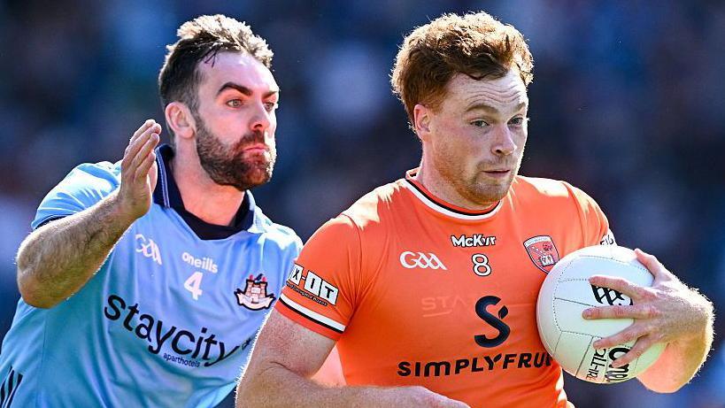 Jason Duffy of Armagh is tackled by Sean MacMahon of Dublin during the 2025 All-Ireland Senior Football Championship meeting between the sides