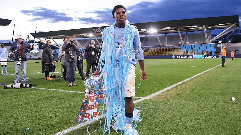 Ryan McAidoo holding the FA Youth Cup