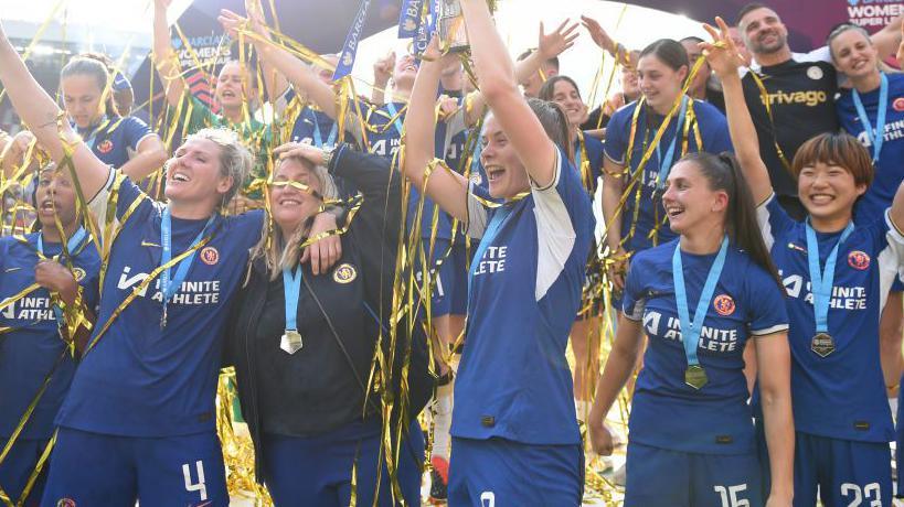 Chelsea players celebrate winning the WSL in May