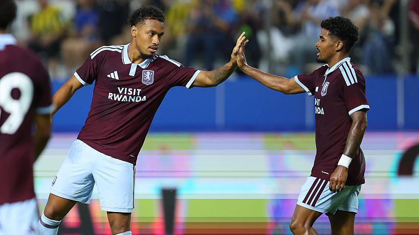 Boubacar Kamara of Aston Villa celebrates with teammates after scoring the team's third goal 