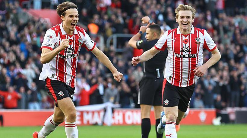 Caspar Jander (left) and Flynn Downes celebrate after Southampton score at St Mary's Stadium