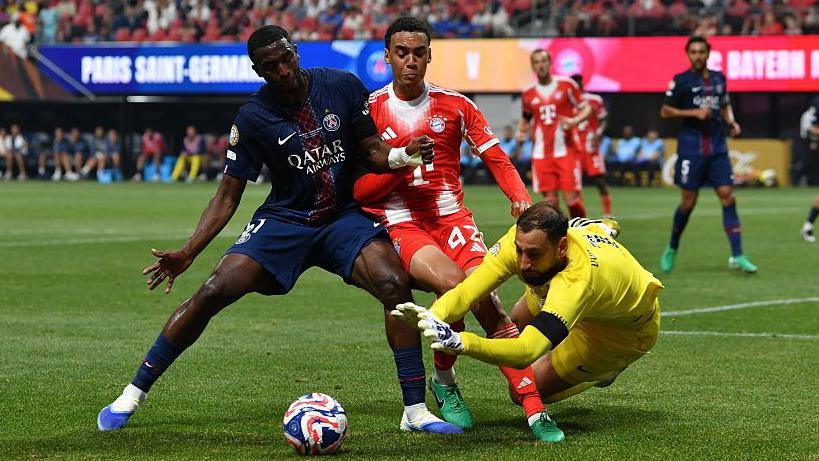 Gianluigi Donnarumma dives at the feet of Jamal Musiala in Paris St-Germain's Club World Cup quarter-final against Bayern Munich