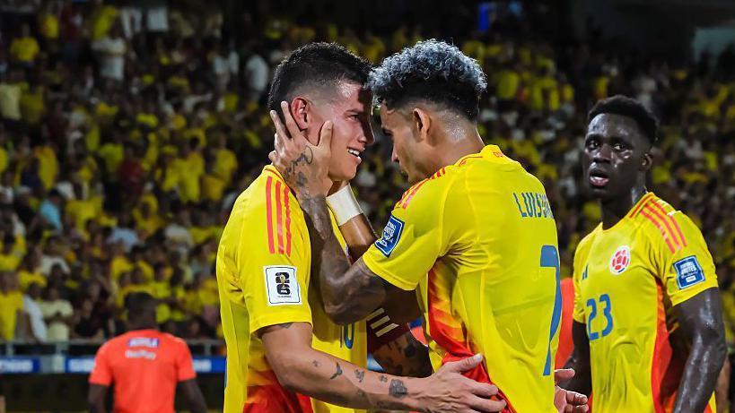 James Rodriguez of Colombia celebrates with team-mate Luis Diaz in a World Cup qualifier against Bolivia
