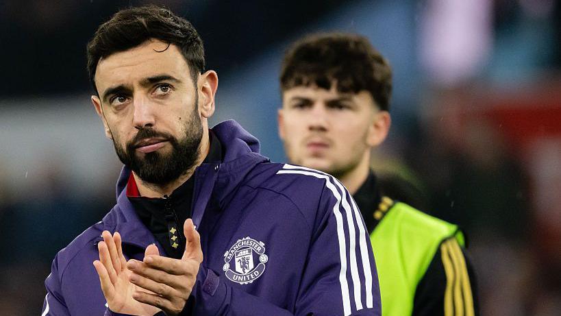 Bruno Fernandes applauds Manchester United's fans after the 2-1 loss at Aston Villa