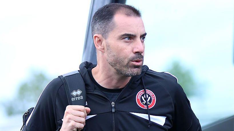 Sheffield United boss Ruben Selles walks off the team coach