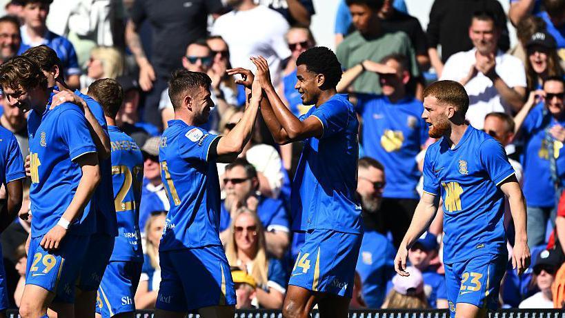 Jhon Solis is congratulated by his Birmingham team-mates after scoring
