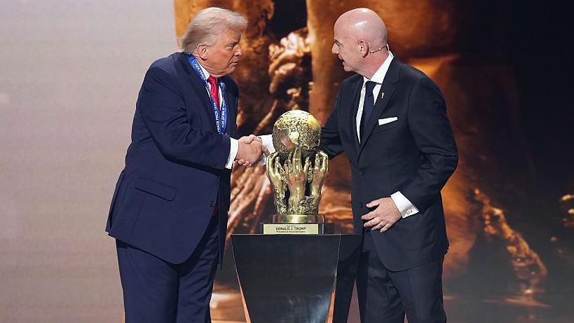 U.S. President Donald Trump receives the FIFA Peace Prize from FIFA President Gianni Infantino 