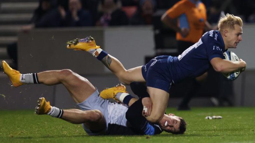 Arron Reed scoring a try for Sale Sharks v Newcastle Falcons