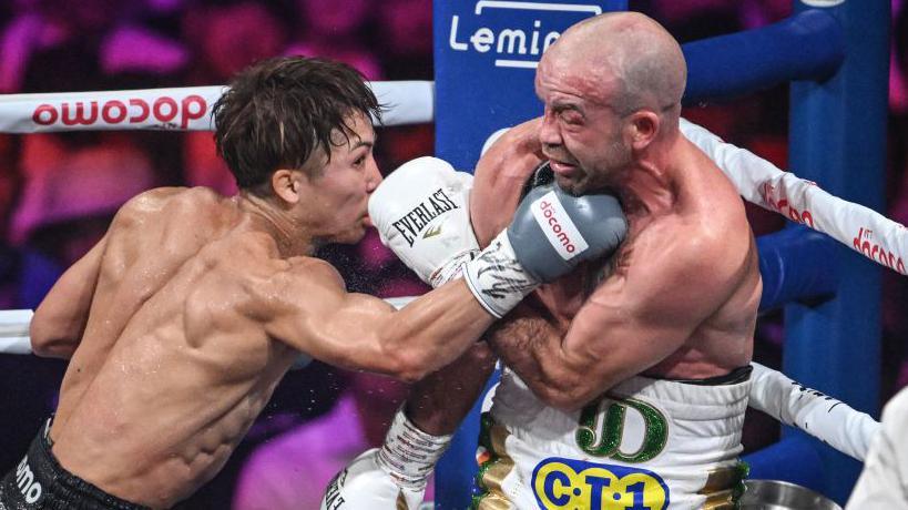 Naoya Inoue lands a punch on TJ Doheny during their undisputed bout in Tokyo