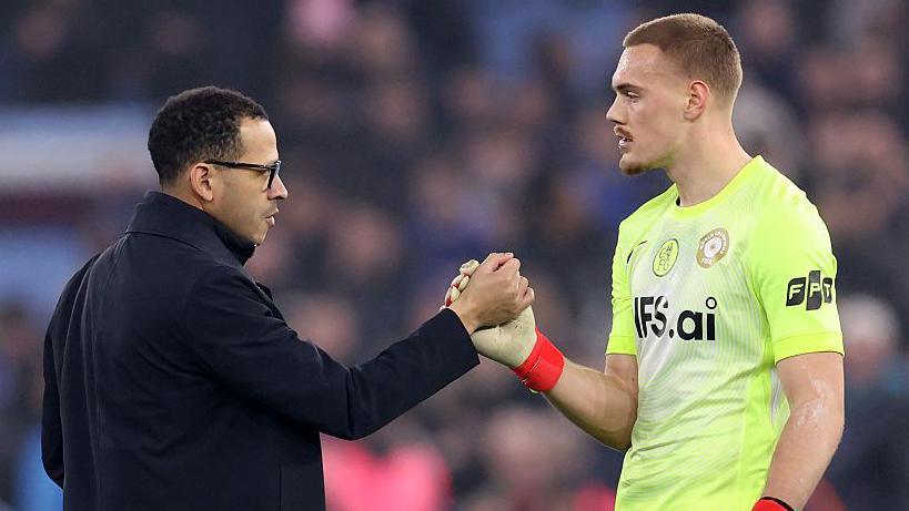 Liam Rosenior clasping hands with goalkeeper Filip Jorgensen